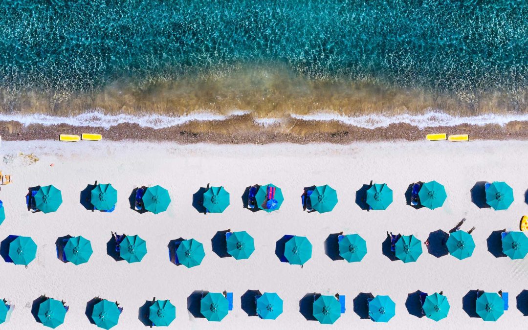 an aerial view of umbrellas on a beach in Lake Tahoe California