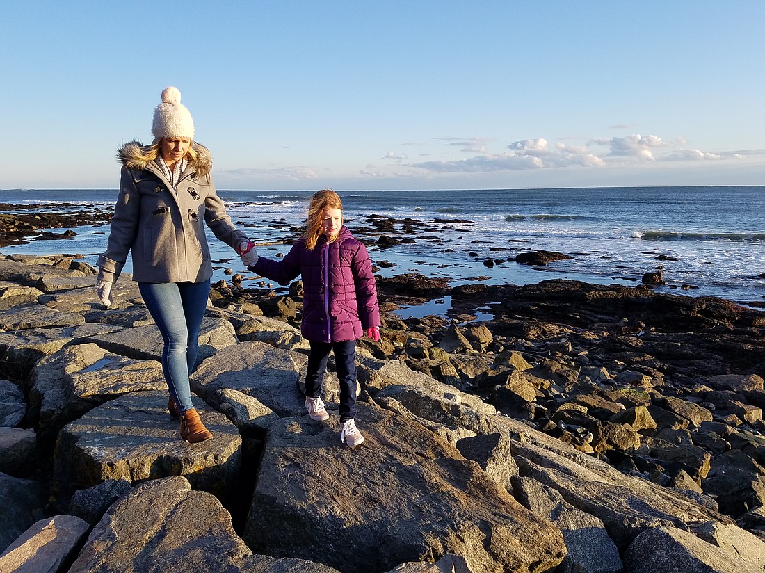 Rebecca Cavaliere explores a rocky coastline with daughter Charlotte a few years back, in the same spirit that she and her own mother, Helene, used to explore the world when she was young. (Photo: Mike Cavaliere)