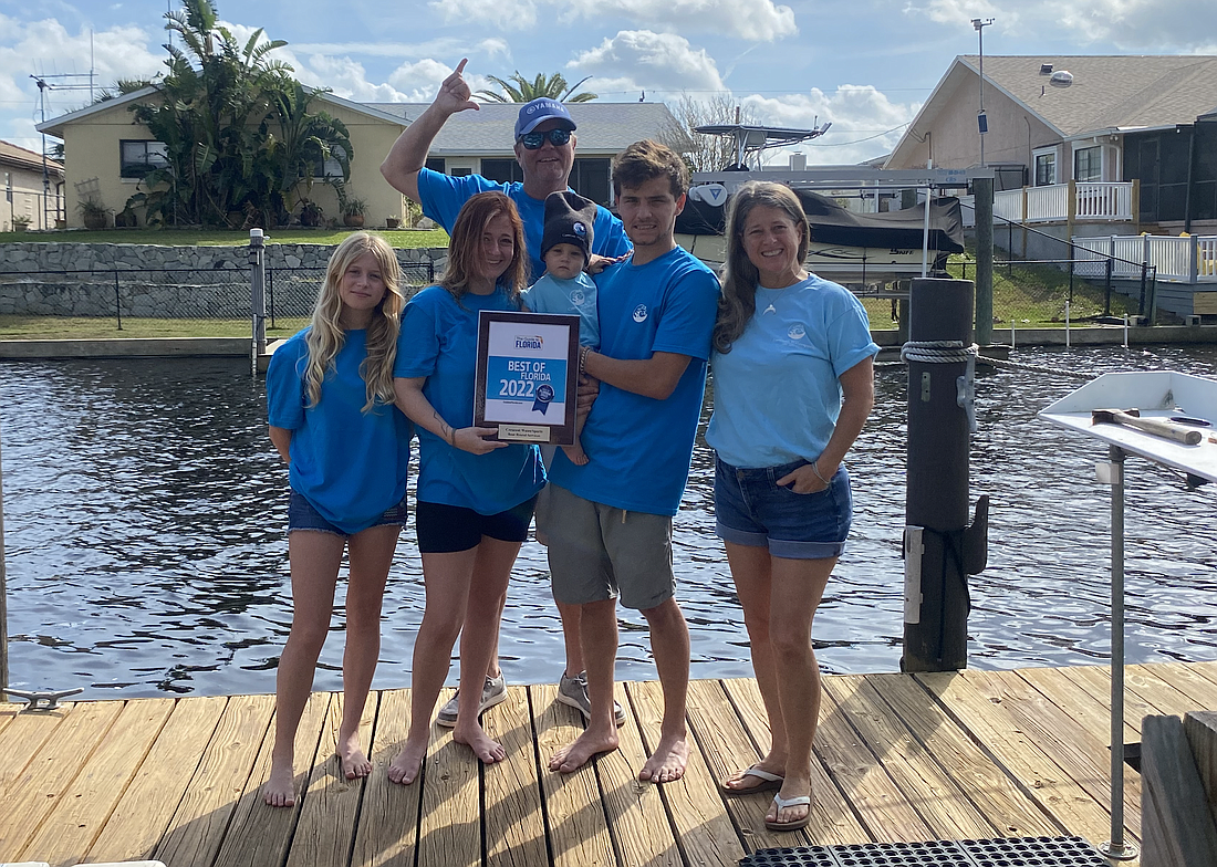 The Williams family — Kai, Avie, Sage, Sam and Kelly Williams (front row), with Captain Dru Williams  — pose with a plaque from last year's Best of Florida award. Courtesy photo